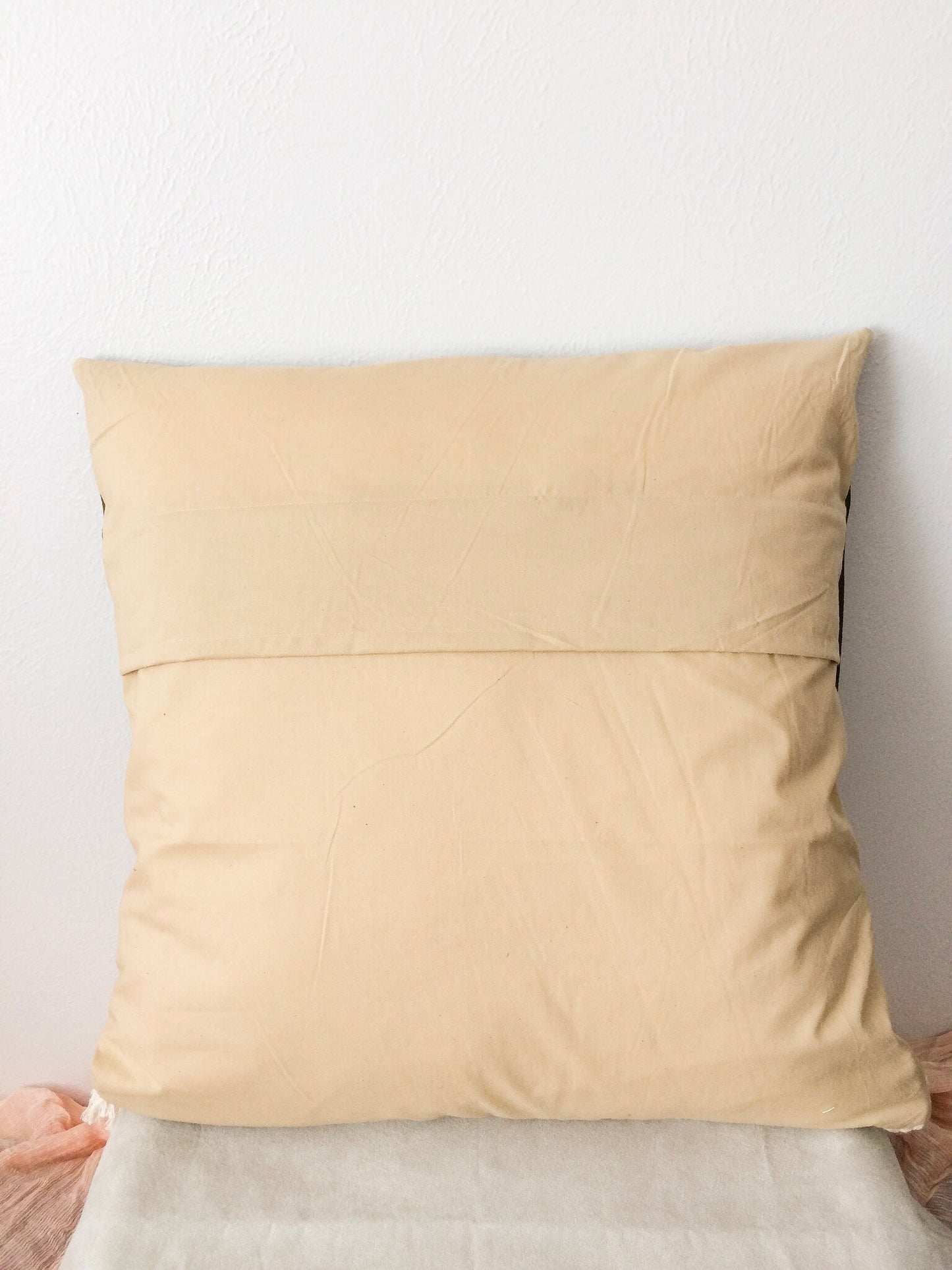Brown leather and fringe woven pillow