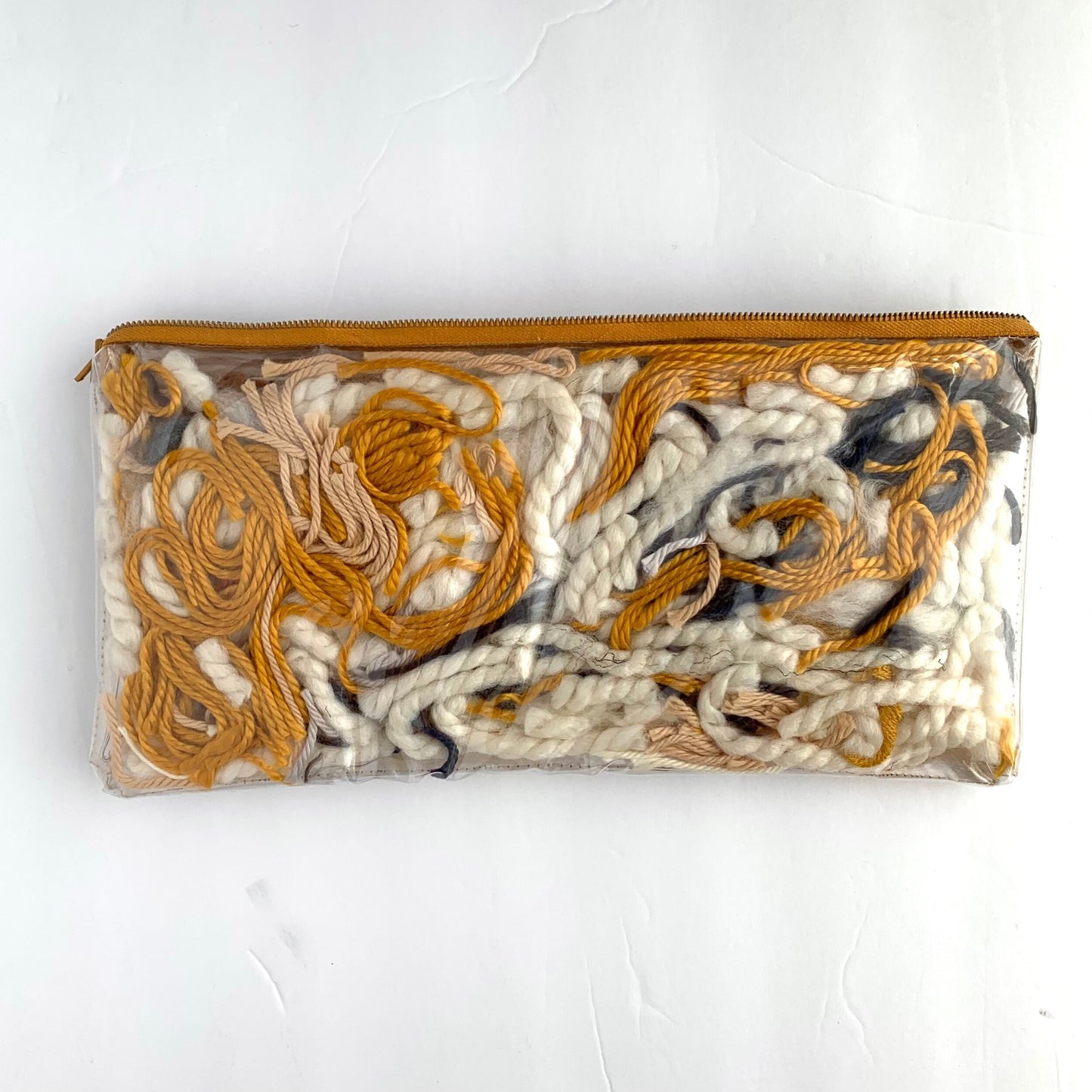 Small upcycled pouch / 2 sided yarn filled