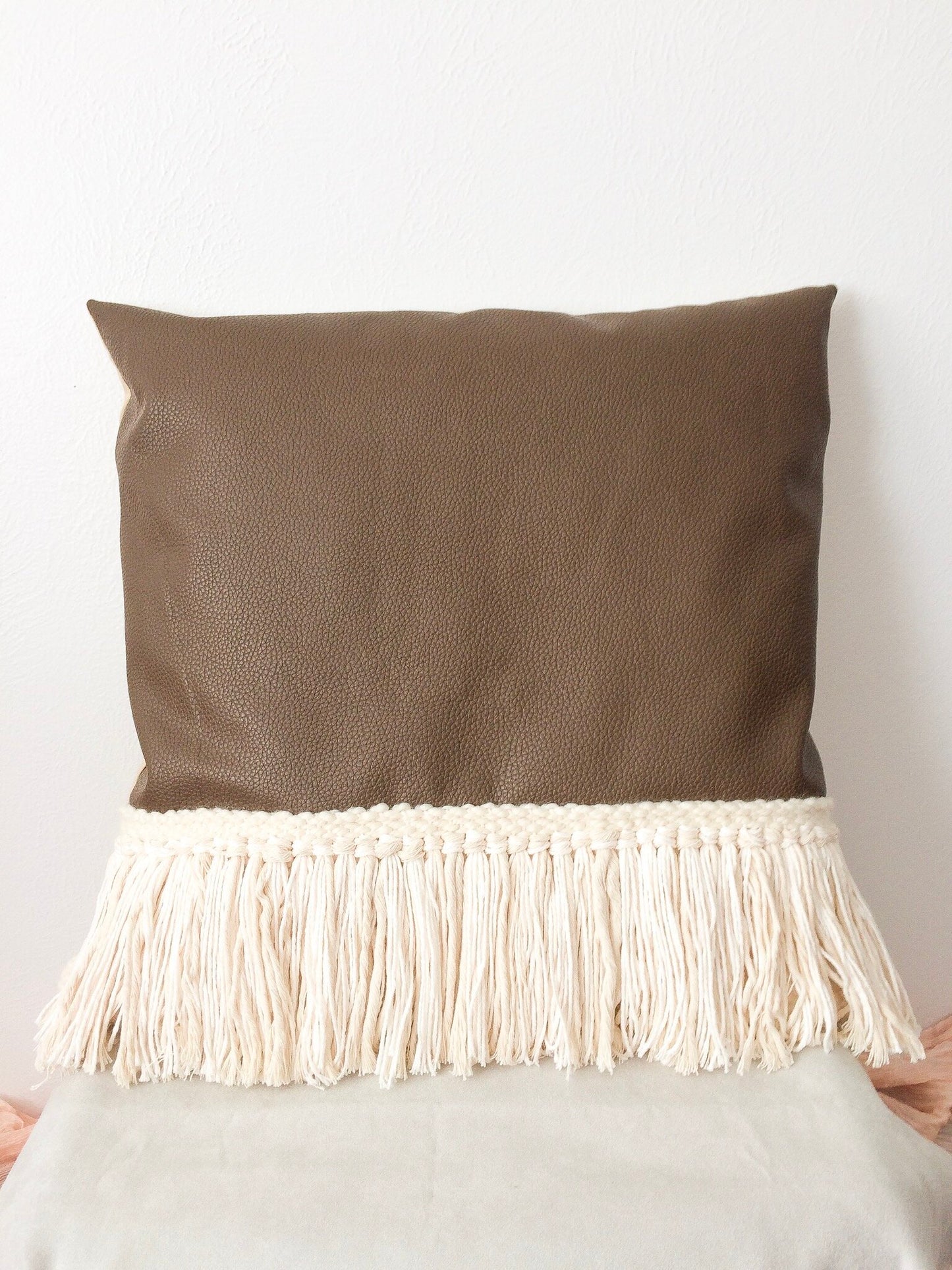 Brown leather and fringe woven pillow