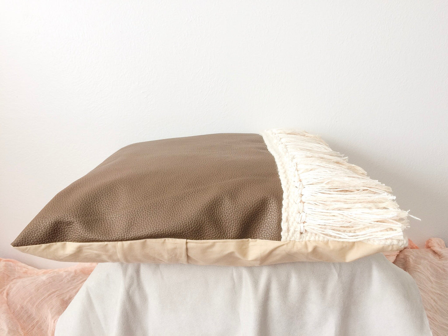Brown leather and fringe woven pillow